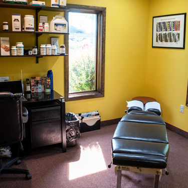 Chiropractic table in exam room