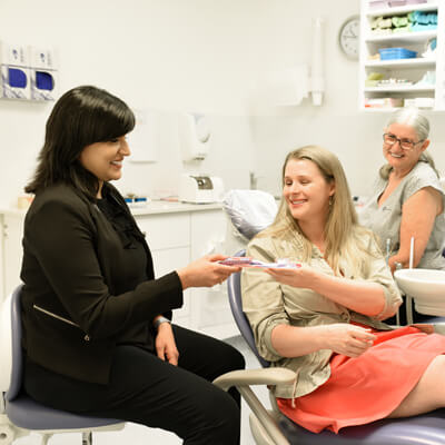 Dr Shilpa with patient and dental assistant