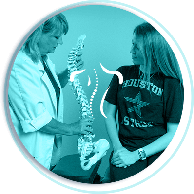 Dr. Nicole showing patient spine model