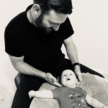 Dr. Aaron adjusting baby