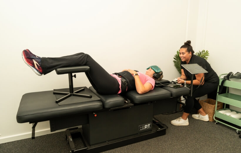 Patient lying on chiropractic bed