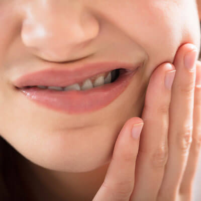 closeup-young-woman-with-tooth-ache