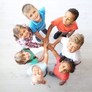 group of kids hands in cirlcle