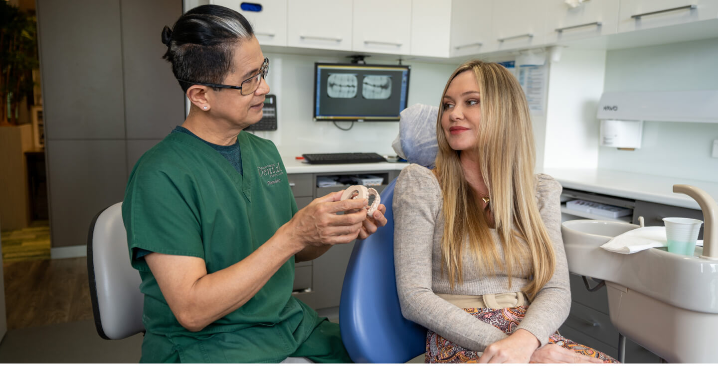 Dentist talking to patient
