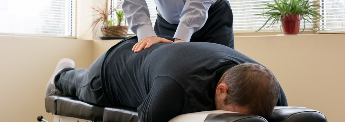 patient having back adjusted