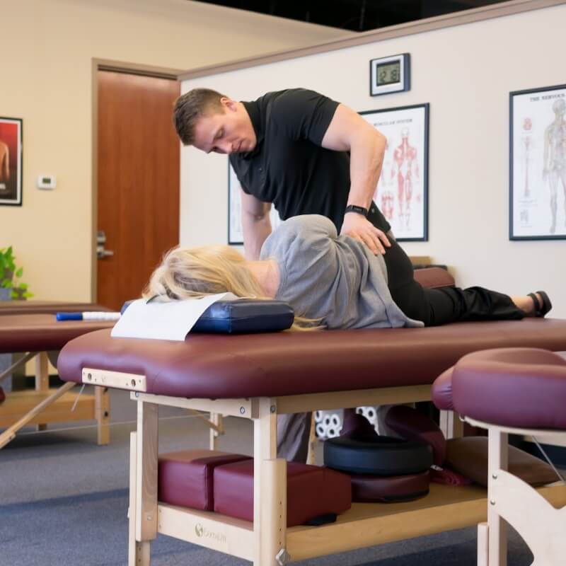 patient having back adjusted