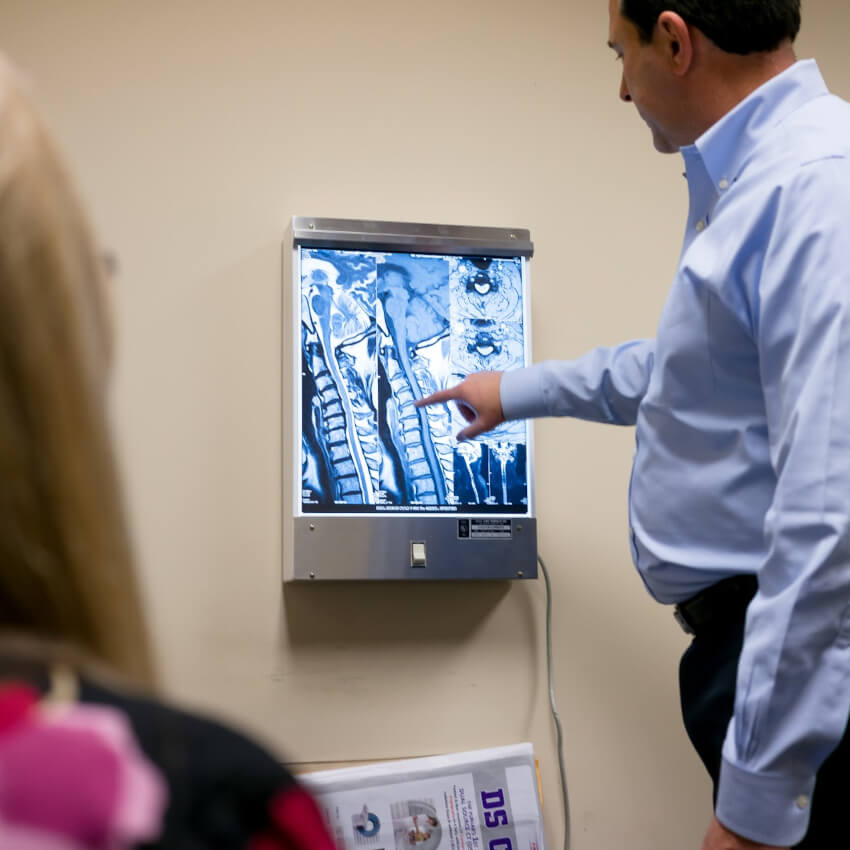 Doctor showing patient xrays