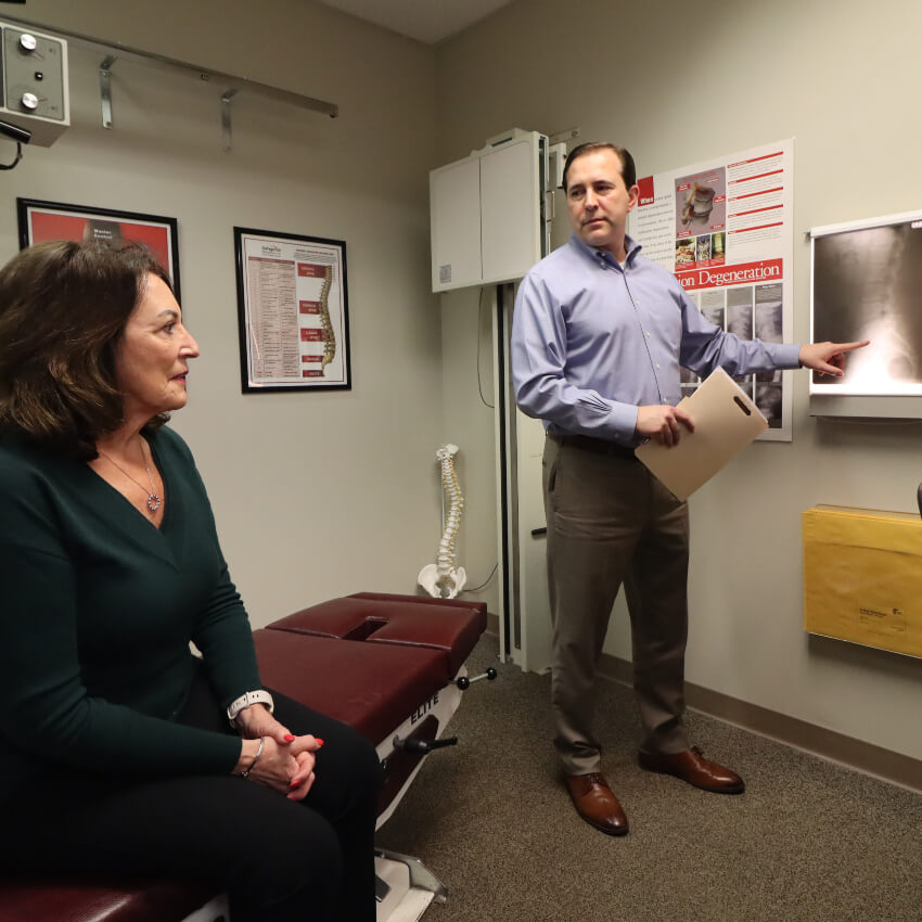 Doctor reviewing xrays with a patient