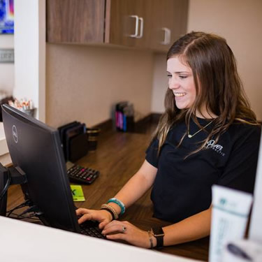 Receptionist at desk