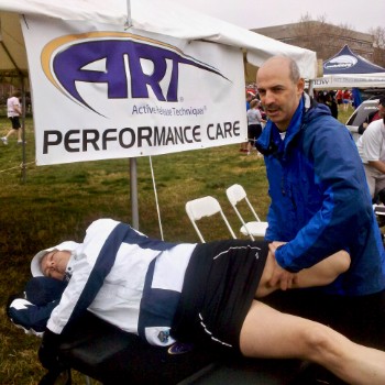 Dr Skopp adjusting athlete