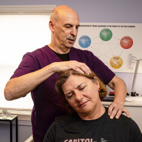 Dr. Martin adjusting patient