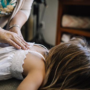 Dr Michelle adjusting girls back