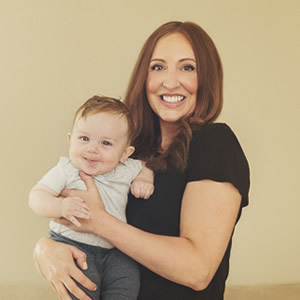 Sheena holding a baby