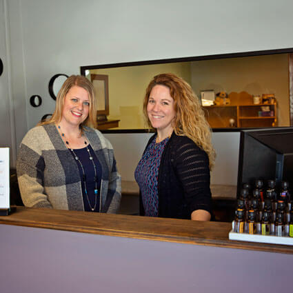 Team smiling at front desk