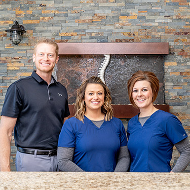 Engelken Chiropractic & Acupuncture team behind front desk