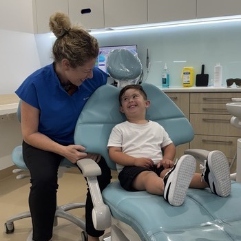 biy smiling in dental chair