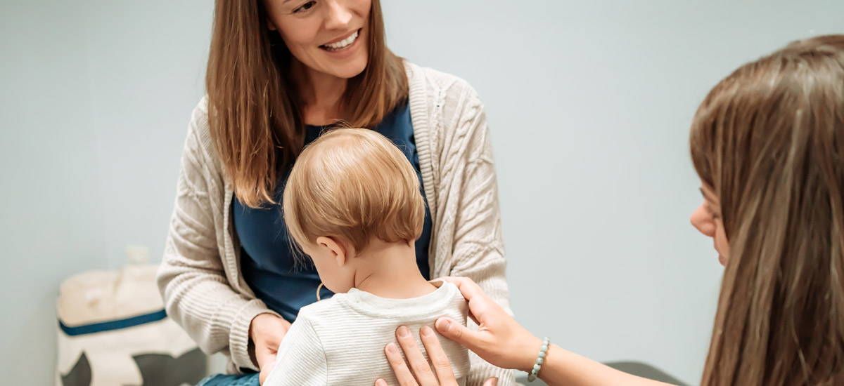 Dr. Jill Mork adjusting infant
