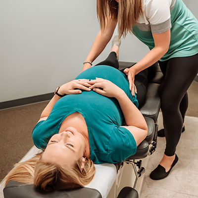 Pregnant woman getting adjusted