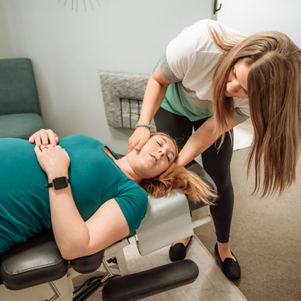 Pregnant woman getting an adjustment