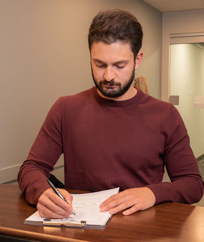 Man filling out paperwork