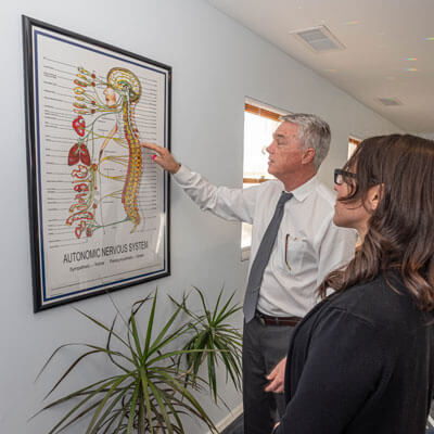 Dr. Fisk talking showing patient chart