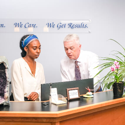 Dr Fisk and staff at front desk