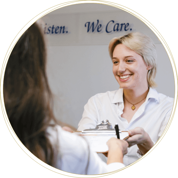 Integrative Chiropractic staff handling patient a form