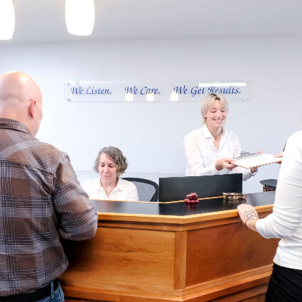 Group at Integrative Chiropractic reception desk