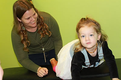 Dr. Carolyn looking at young girl