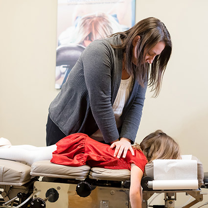 Little girl getting back adjustment