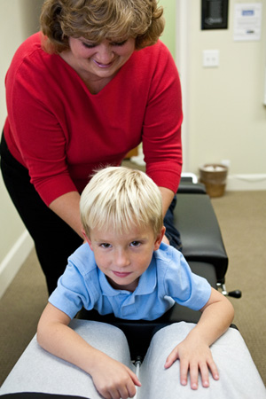 Dr. Stacy Gray adjusting child