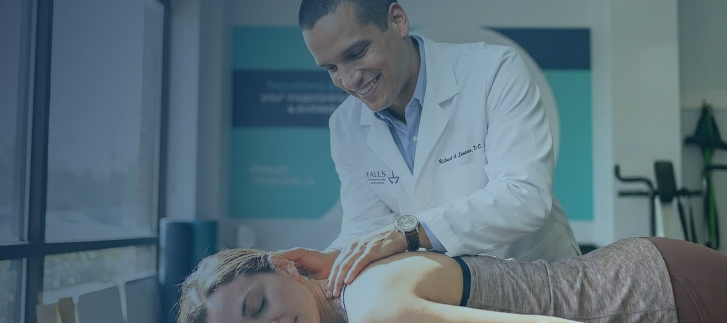 Chiropractor adjusting patient