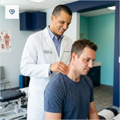 Chiropractor checking patient