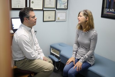 Dr. Schulman talking to woman