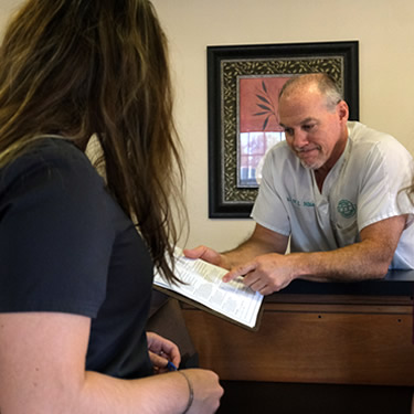 Dr. Niblo with patient paperwork