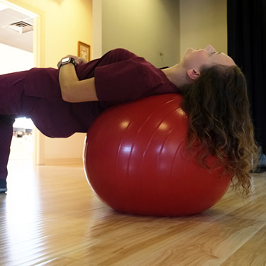 Woman using exercise ball