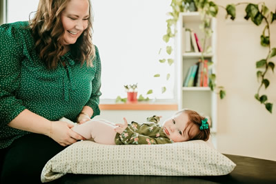 Dr. Kathleen smiling at girl