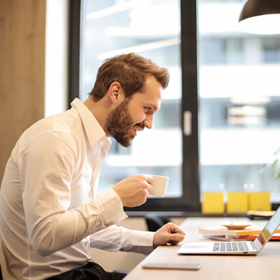 man sitting in front of laptop