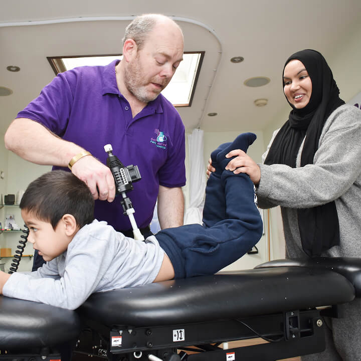 Chiropractor adjusting patient