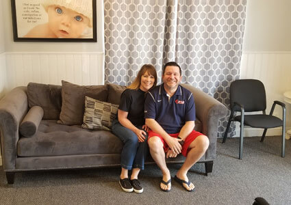 Couple sitting in waiting room