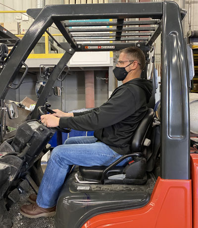 Man Driving Forklift