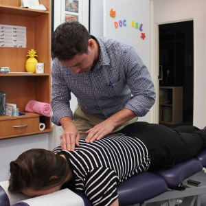 Chiropractor performing an adjustment