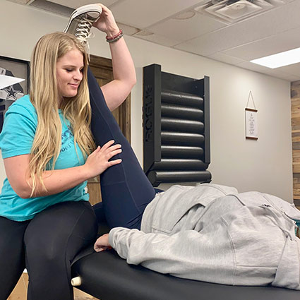 deja stretching a patients leg