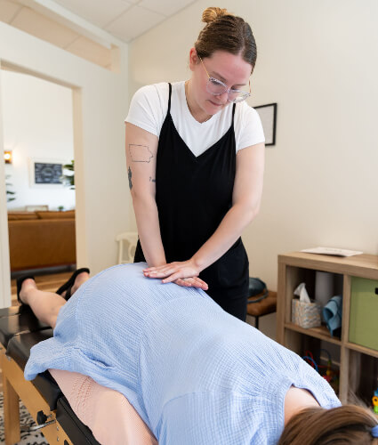 Chiropractor adjusting lower-back