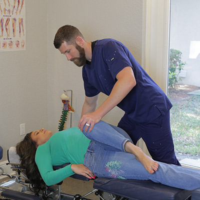 Dr. Justin adjusting woman