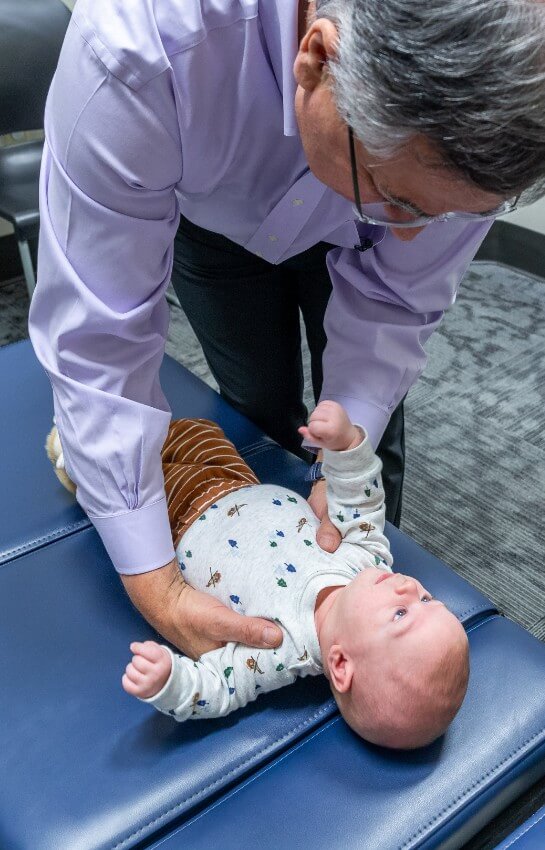 Doctor adjusting baby