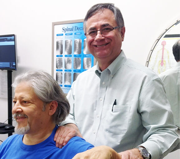 Dr. Longie smiling with patient