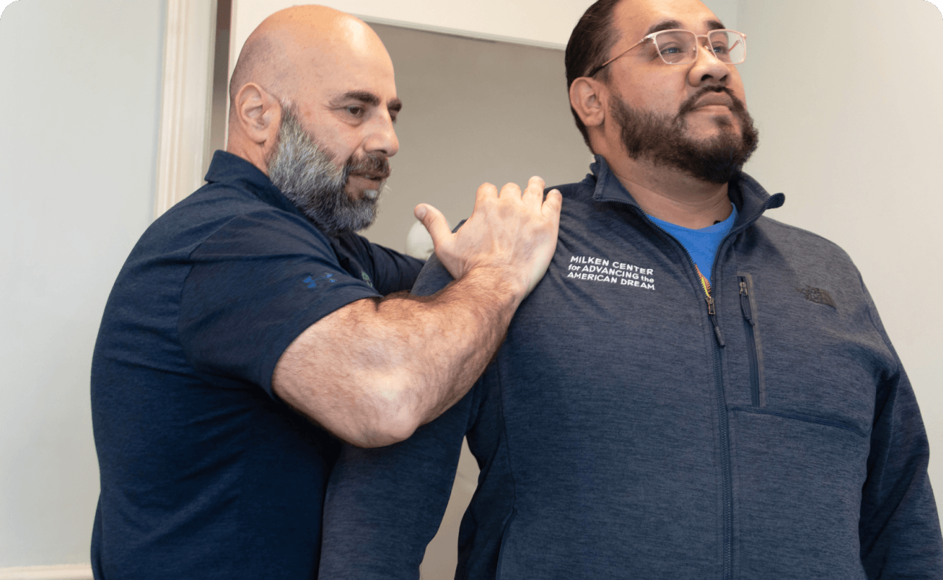 patient having back adjusted by chiropractor