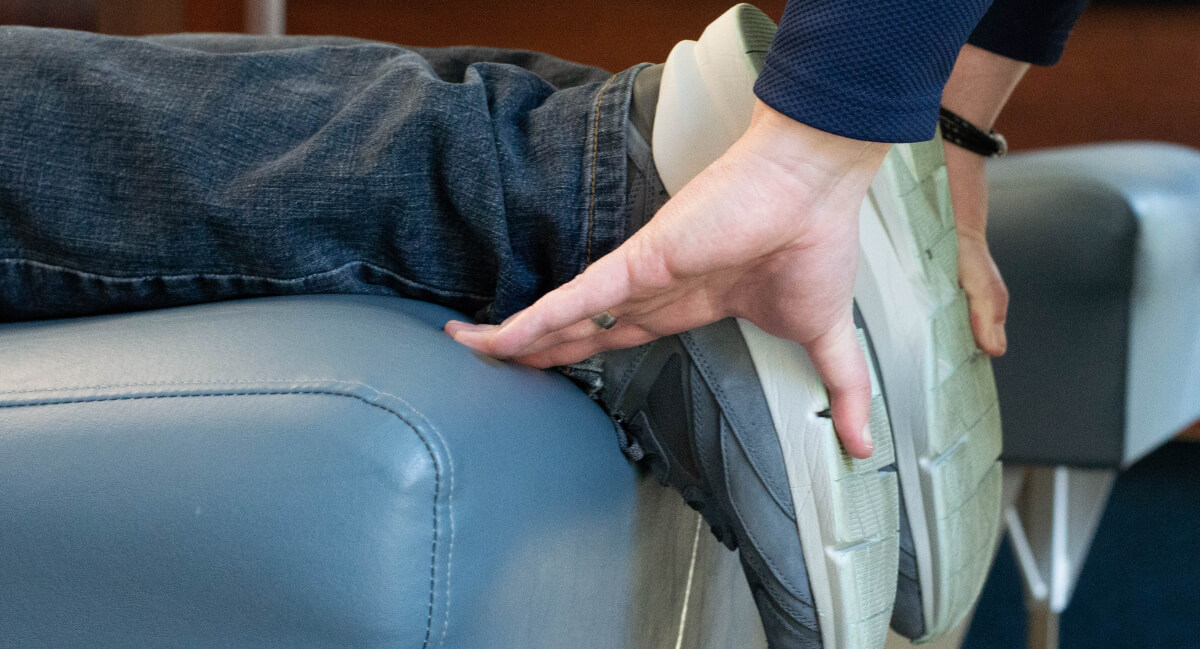 Chiropractor adjusting patient's feet