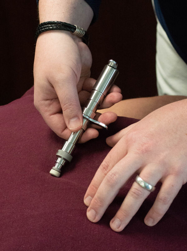 Chiropractor using Torque Release Technique to treat a patient